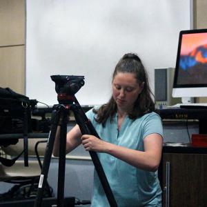 Lauren Math demonstrates how to set up camera equipment