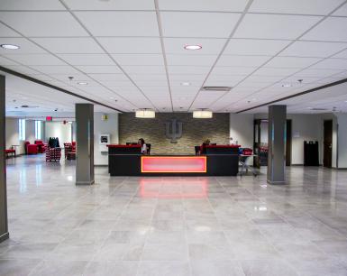 Ernie Pyle Hall’s new lobby, with open space, light-colored flooring and a large reception desk