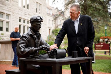 Vietnam War correspondent Joseph Galloway, stands beside the sculpture of Ernie Pyle outside of Franklin Hall.