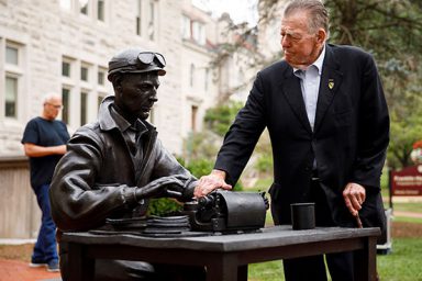 Vietnam War correspondent Joseph Galloway stands beside the sculpture of Ernie Pyle outside Franklin Hall.