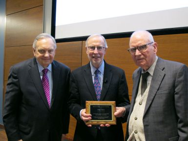 Dan Balz, senior correspondent with The Washington Post, accepts the Lee H. Hamilton Public Service Fellowship plaque from Lee Hamilton, distinguished scholar in the School of Public and Environmental Affairs and former U.S. representative for Indiana. At left is Edward Carmines, Distinguished Professor, Warner O. Chapman Professor of Political Science and Rudy Professor at IU. Balz visited IU to receive the fellowship and to present a lecture as part of The Media School's Speaker Series. (Anne Kibbler | The Media School)