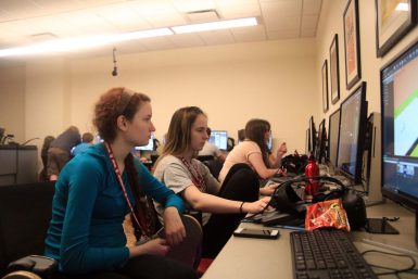 Sophomore Ellie Goldstone and junior Jasmin Herzig help each other on the games they are creating for the Game Development Camp.