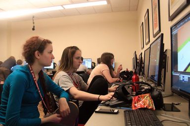 Sophomore Ellie Goldstone and junior Jasmin Herzig help each other on the games they are creating for the Game Development Camp.
