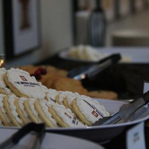 Media School cookies with the school's logo on white icing were served at the reception.