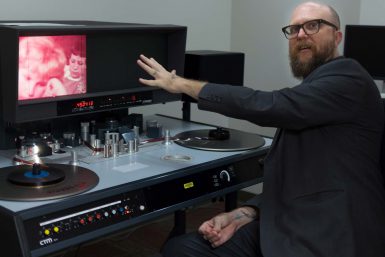 Andy Uhrich, film archivist and assistant librarian at the Indiana University Libraries Moving Image Archive, watches an old film that has not yet been digitized.