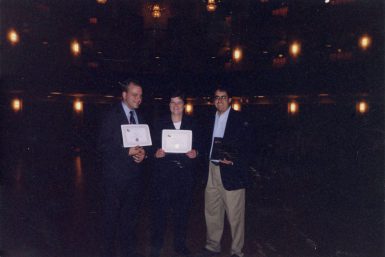 Johnston and Lanosga accept an Investigative Reporters and Editors award in 2000.