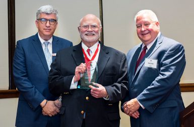 Klugman (middle) accepts his Distinguished Alumni Award from Media School dean Jim Shanahan (left) and Media School Alumni Association president Andy Hall (right)