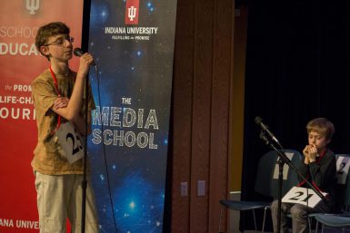 Eighth grader Daniel Larsen takes the microphone at the IU Bee.