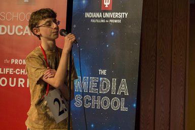 Eighth grader Daniel Larsen takes the microphone at the IU Bee.