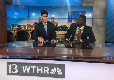 Senior William Mulloy at the WTHR-13 anchor desk