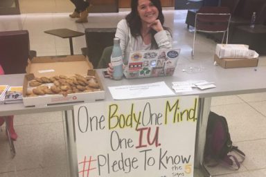 a student selling cookies to promote IU PRSSA's Bateman competition