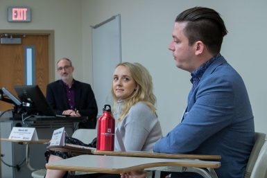 Phil Robinson speaks as Haley Bakker-Arkema and Dave Groobert look on