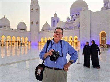 Steve Raymer posing in front of a mosque