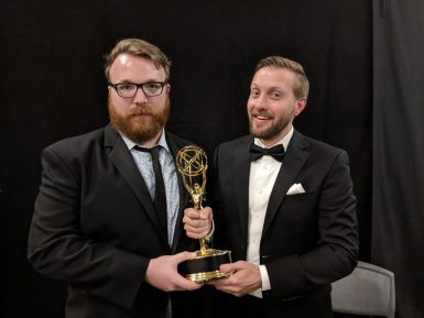 Chad Quandt, left, and Aaron Waltke celebrate backstage after receiving a Daytime Emmy Award for Outstanding Writing in an Animated Program. (Courtesy photo)
