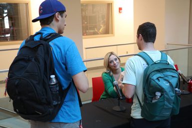 CBS4 and FOX59 sports reporter Tricia Whitaker, BA'12, talks to students after the panel discussion.