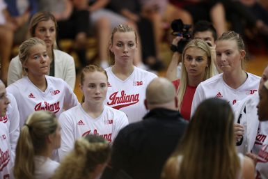 Senior Zain Pyarali films a huddle during the Sept. 21 game against Northwestern.