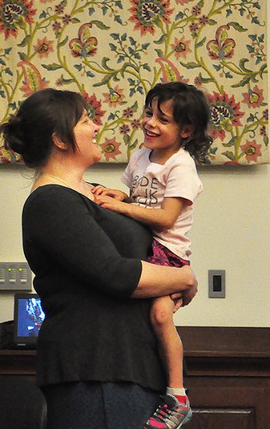 Kelley Benham French holds daughter Juniper during a talk about medical ethics at Hutton Honors College recently. (Michael Williams The Media School)