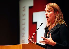 CBS chief foreign correspondent Lara Logan speaking at a podium