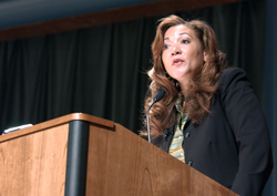 NPR's All Things Considered host Michele Norris speaking at a podium