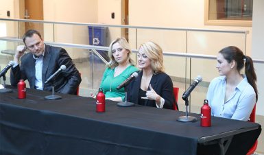 Katie Hargitt, reporter for Verizon IndyCar Series and NBCSN, speaks on a panel with three other Indianapolis-area sports broadcasters.