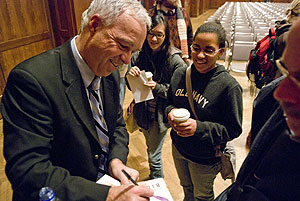 Paulson chatted with students after his talk at Alumni Hall in the IMU. (Photo by Ben Weller)