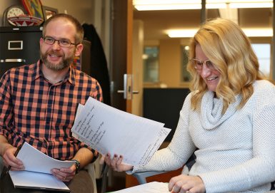 Doctoral students Zach Vaughn, left, and Rachelle Pavelko are working on the judging. (Emma Knutson | The Media School)