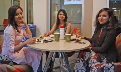 From left, Dulci Suri, Vivekjot Brar and Razia Saleem got acquainted over breakfast before the workshop orientation. (Gena Asher | The Media School) 