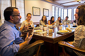 During a roundtable discussion over lunch, Chandrasekaran talked to journalism students about his work — and theirs. (Photo by Steve Raymer)