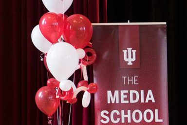 The Media School banner with balloons