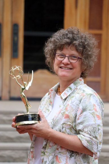 Senior Lecturer Susanne Schwibs holding her regional Emmy