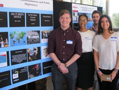From left, Zach Watt, Bria Maxey, Remy Bonett and Kyle Gelfand present their team project during the poster session. (Gena Asher | The Media School)