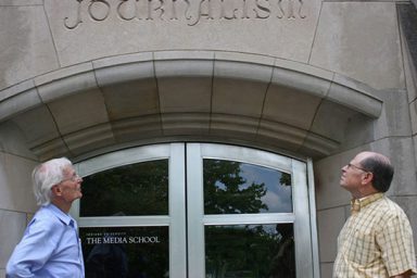 Professor emeritus Cleve Wilhoit and Distinguished professor emeritus David H. Weaver stand in front of Ernie Pyle Hall