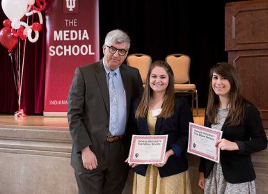 From left, Dean Shanahan presented undergrads Sara Miller and Taylor Telford with their research awards. (Ann Schertz | The Media School)