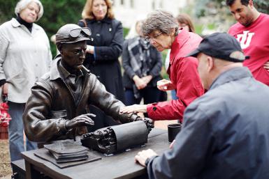 Crowd with sculpture