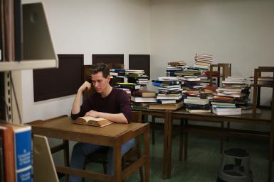 Julian Goodwin-Ferris, a senior ballet major, films a scene on the eighth floor of the east stacks of the Wells library. Goodwin is one of the film's two feature performers.