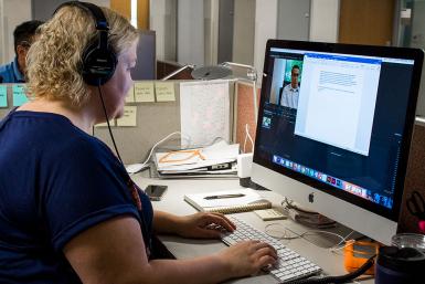 Edwards edits a video about a farm near Evansville.