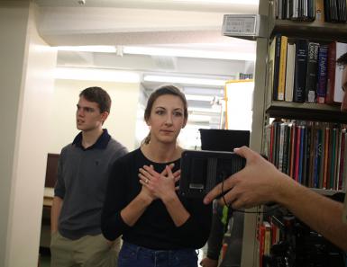 Director Kasey Poracky, an M.S. student in The Media School, reviews a scene shot in the Wells library. Poracky worked with Jacobs School of Music ballet students and Media School undergraduates to create Shift, a short film featuring 14 dancers.