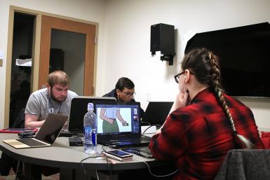 Students work in a group of three to create video games and characters for Global Game Jam on Jan. 26 in the game lab of Franklin Hall.