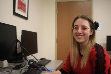 Junior Beth Lula sitting at a computer