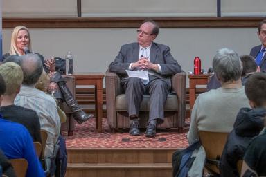Three people sitting in chairs on stage: CNN attorney Lee Williams, associate professor Tony Fargo and New York Times correspondent Michael Tackett.