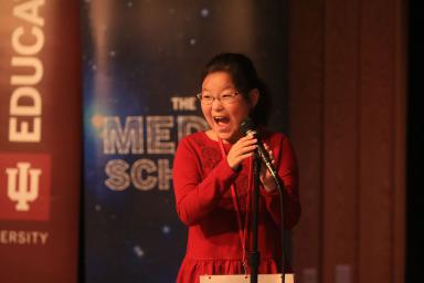 University Elementary School fourth grader Yena Park gasps into the microphone after winning the IU Bee.