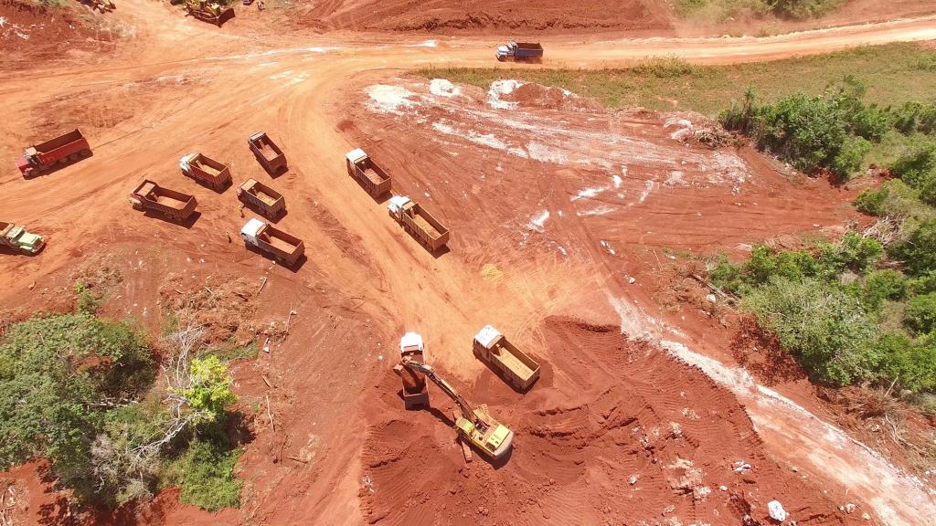 Aerial footage of trucks mining bauxite in Jamaica