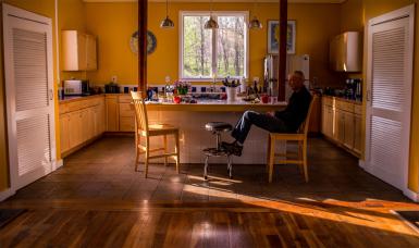 Craig Guyon sits in the kitchen of his home in Lanesville, Indiana.