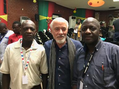 Professor Michael Martin posing with the two sons of the late Senegalese pioneer filmmaker Paulin Vieyra.