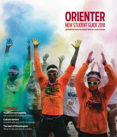 The cover of the 2018 Orienter. It shows students running through colored powder at the color run.