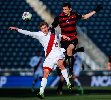 Freshman forward Justin Rennicks jumps for the ball in the first half of a soccer game against Stanford at the NCAA College Cup final at Talen Energy Stadium in Chester, Pa. on Dec. 10, 2017. 