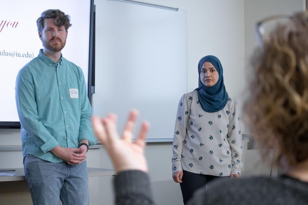 Media School doctoral candidate Josh Sites and School of Education doctoral candidate Zawan Al Bulushi listen as an audience member asks a question during the paper session, "Mediating Sight, Hearing and Touch." 