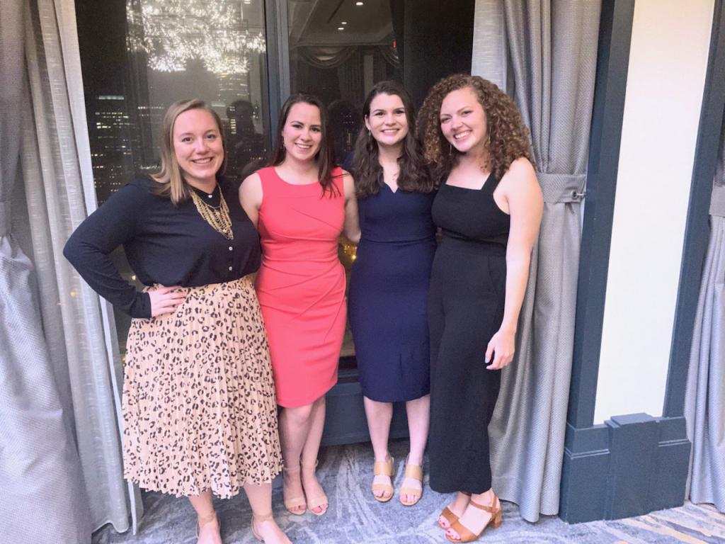 Laurel Demkovich, Sarah Verschoor, Caroline Anders and Lydia Gerike pose outside a doorway at at a Hearst event.