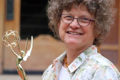 Susanne Schwibs holds an Emmy