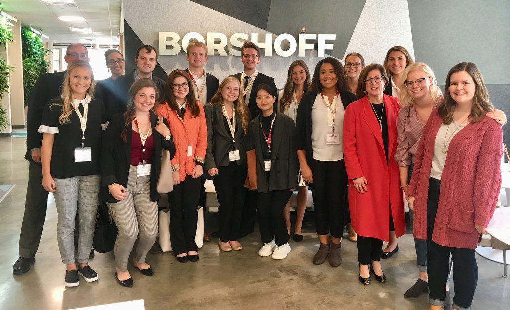 A group of students poses at Borshoff public relations agency